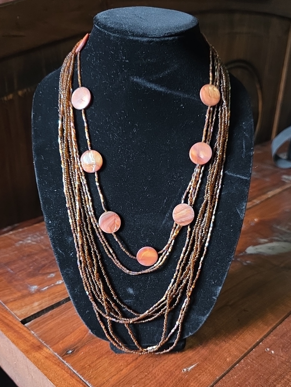 Layered Brown Beaded Necklace with Orange Shell Discs